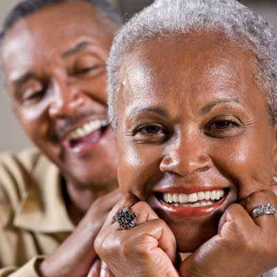 In the photo, an older adult Black couple represents Clute Wealth Management financial services for retirees or those planning for retirement